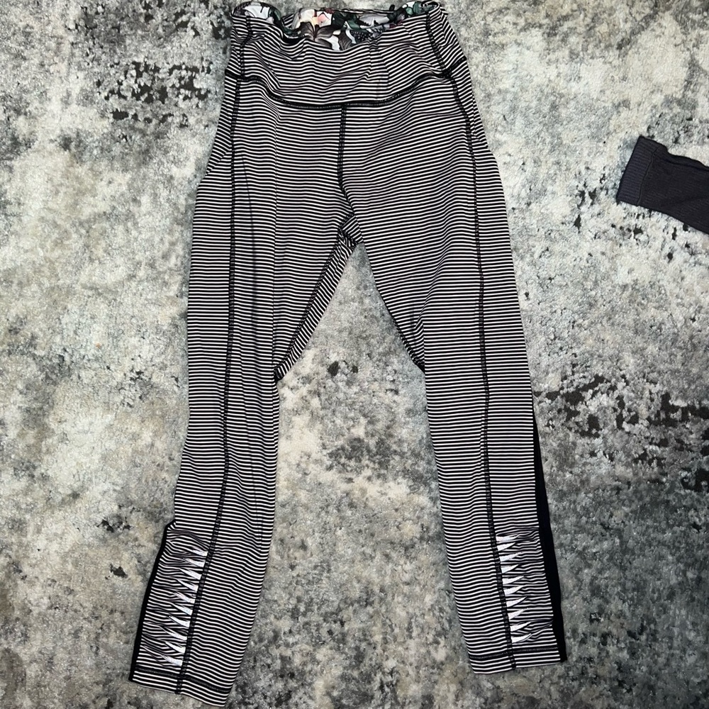 Cropped light pink and black cropped lululemon leggings